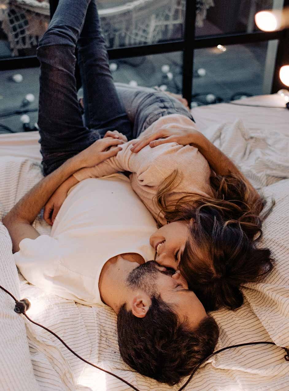 happy couple on bed after erectile dysfunction treatment in Nashville