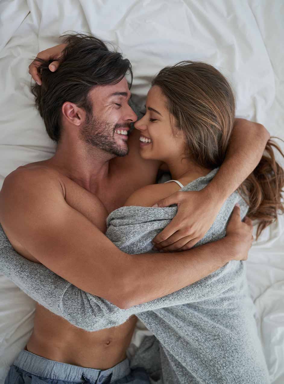 Happy couple in bed after the P-shot treatment in Longview, TX