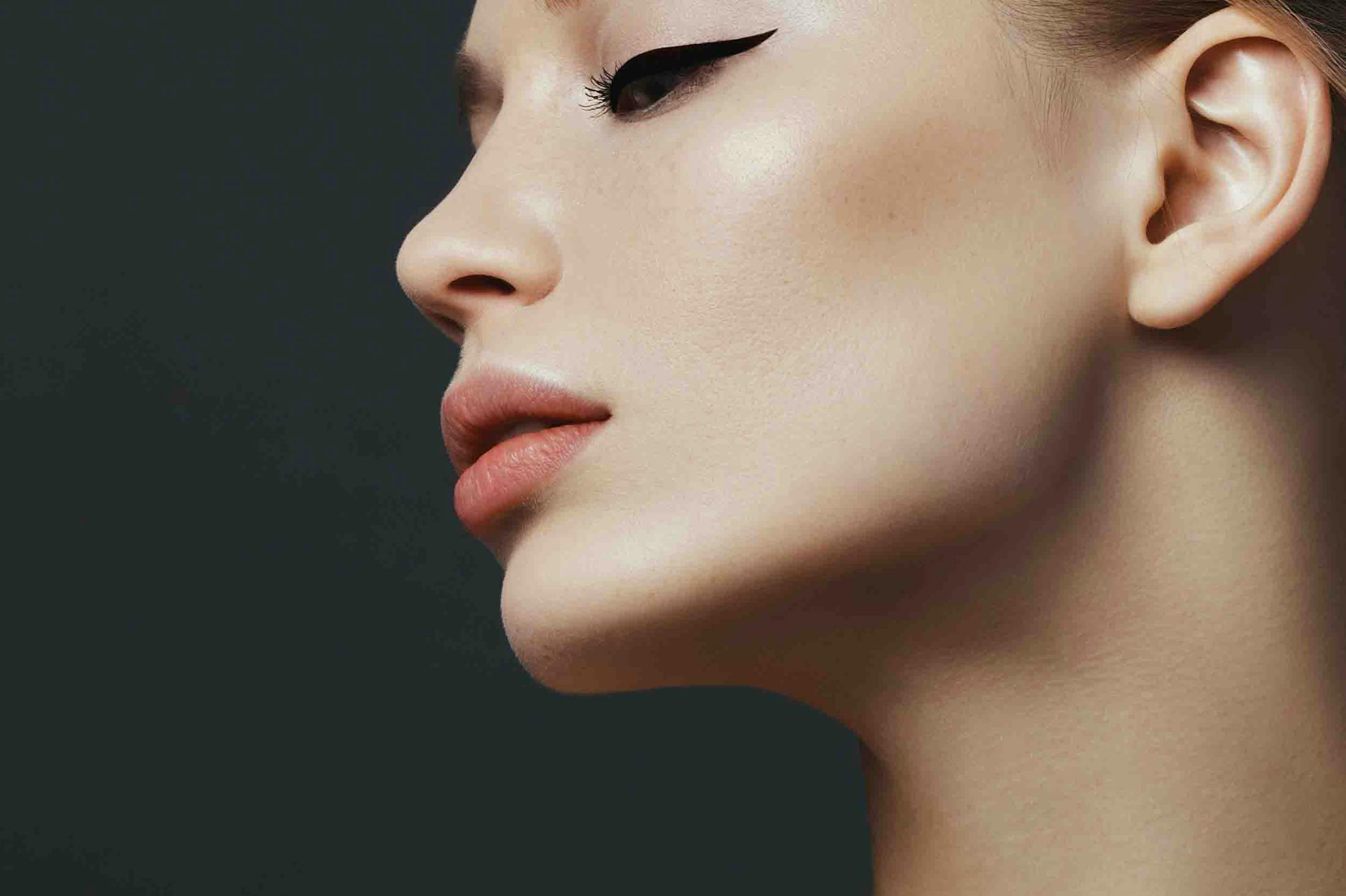 Woman with beautiful skin post dermal fillers treatment at Genesis Lifestyle Medicine.