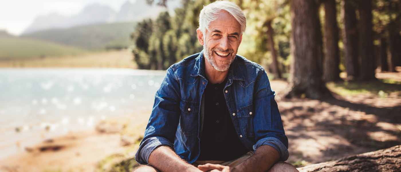 Happy man outside after GAINSWave therapy from Genesis Lifestyle Medicine.