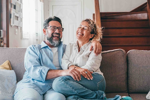Laughing couple after ED treatment from Genesis Lifestyle Medicine.