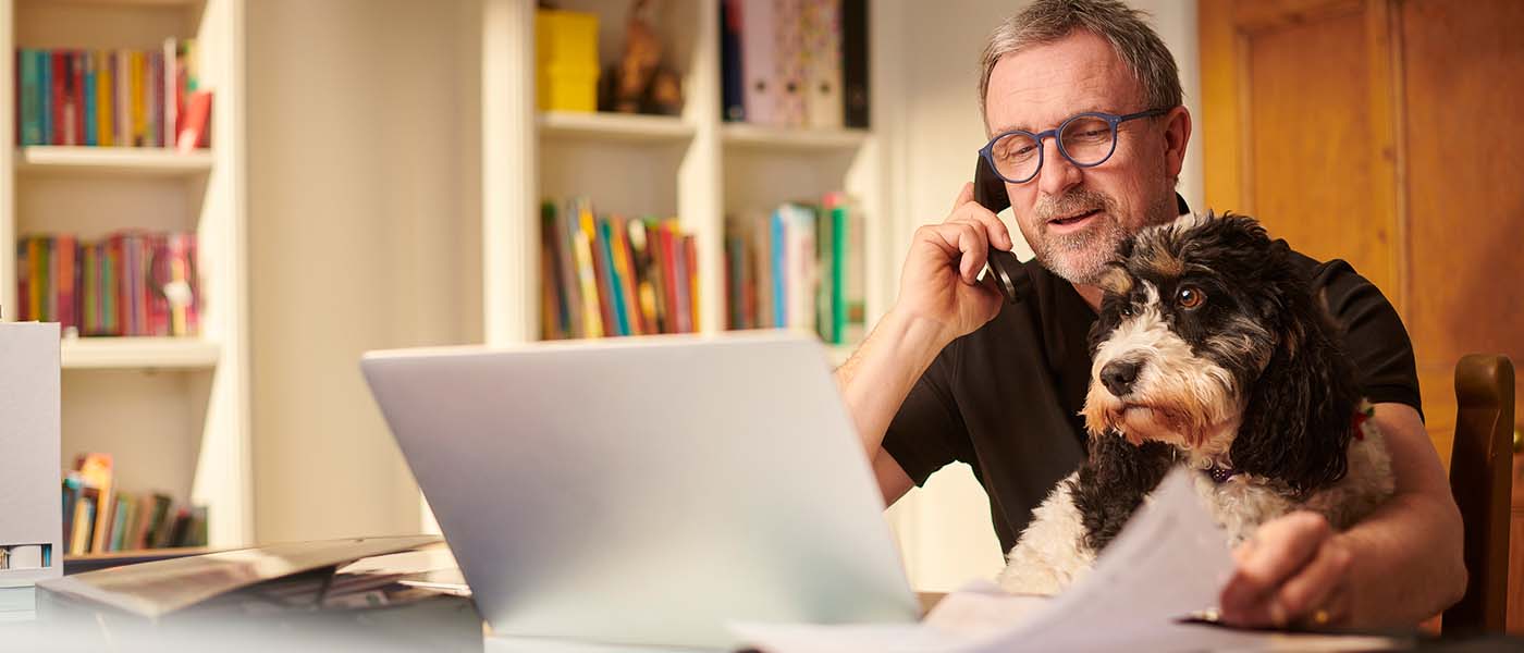 man scheduling online consultation at Genesis Lifestyle Medicine