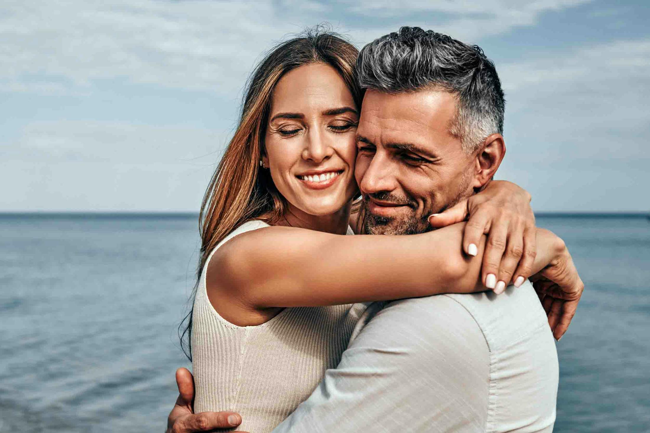 Man hugging his wife after receiving TRT from Genesis Lifestyle Medicine.