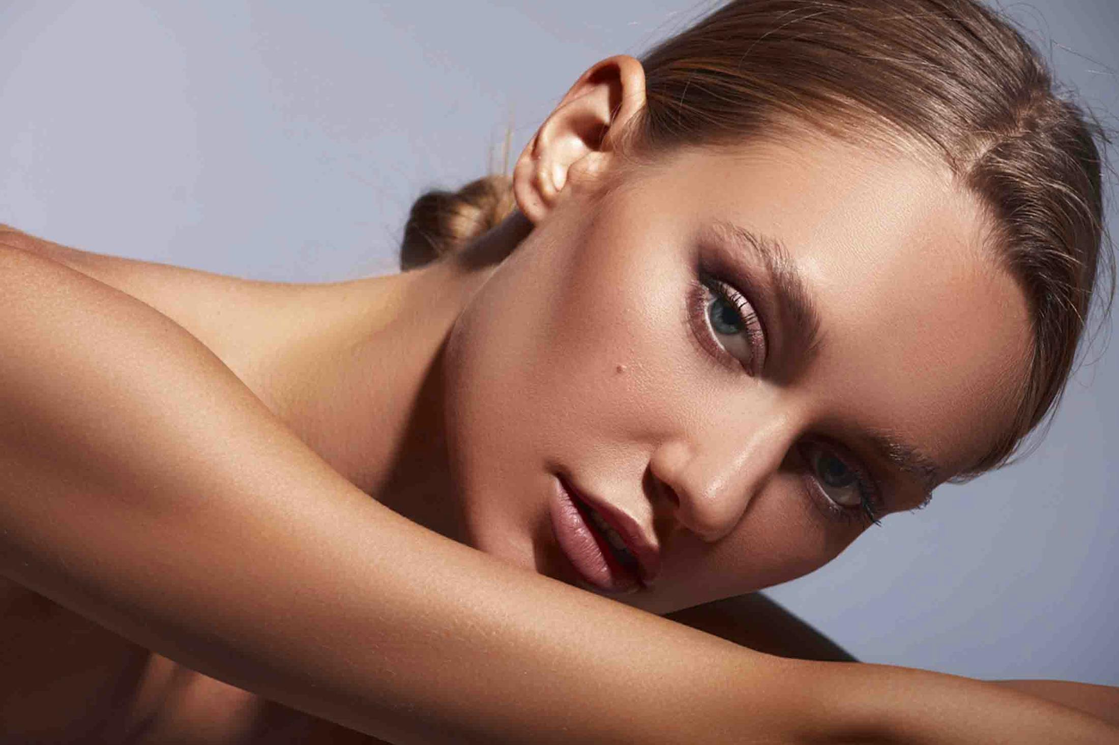 Woman showing successful results from Morpheus8 treatment at Genesis Lifestyle Medicine.