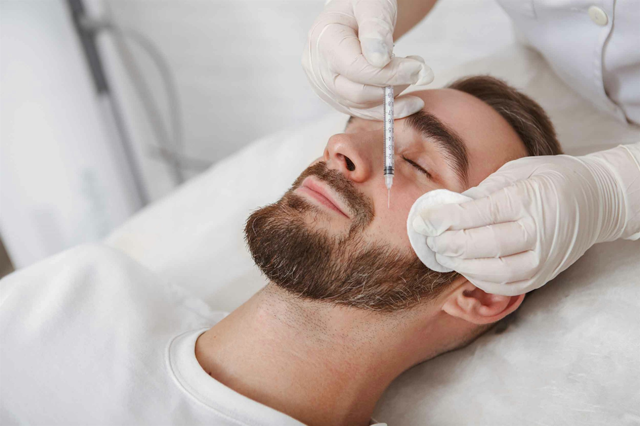 man receiving dermal fillers at Genesis Lifestyle Medicine in Denver