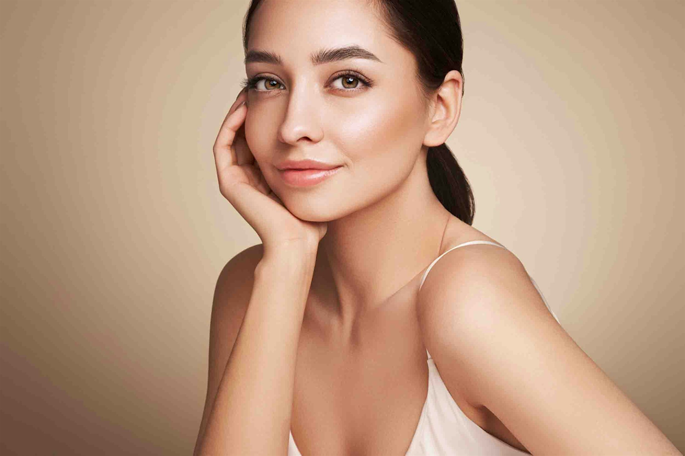 Smiling woman after receiving Botox at Genesis Lifestyle Medicine.