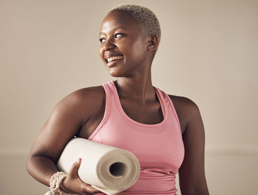 girl with yoga mat after vitamin injections in Fishers