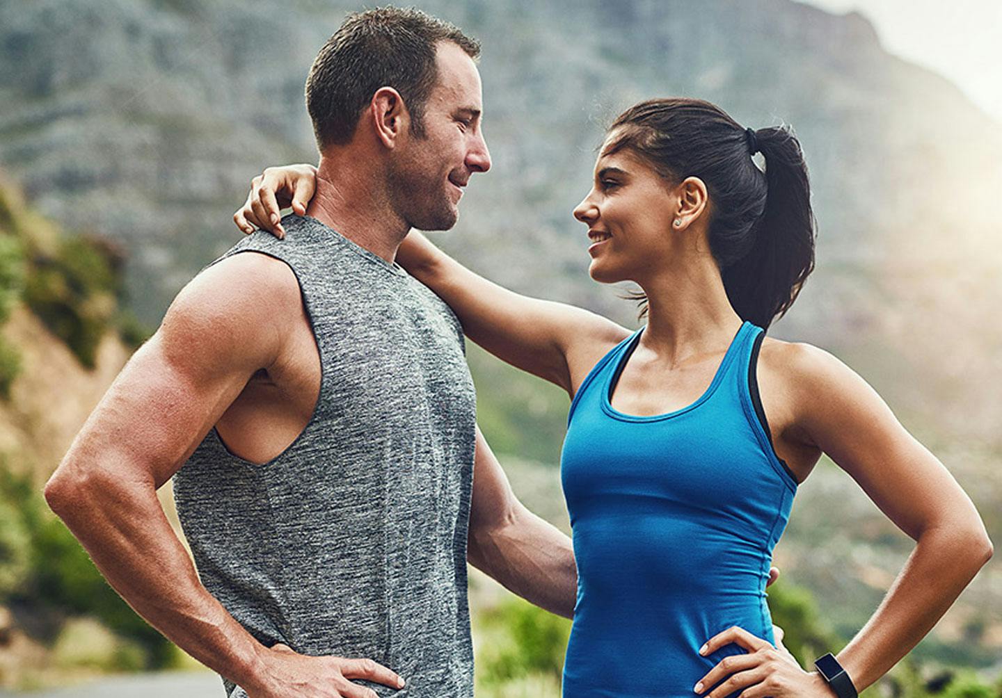 Happy couple on a hike after ED treatment from Genesis Lifestyle Medicine.