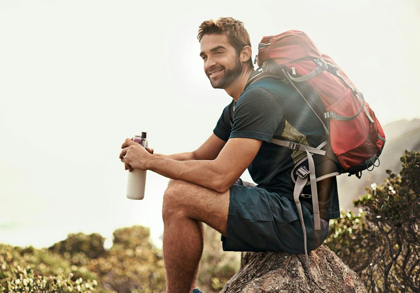 Man hiking after doing a medical weight loss program at Genesis Lifestyle Medicine.