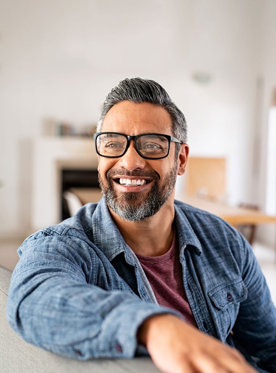 smiling confident man indoors after hormone therapy in Omaha, NE