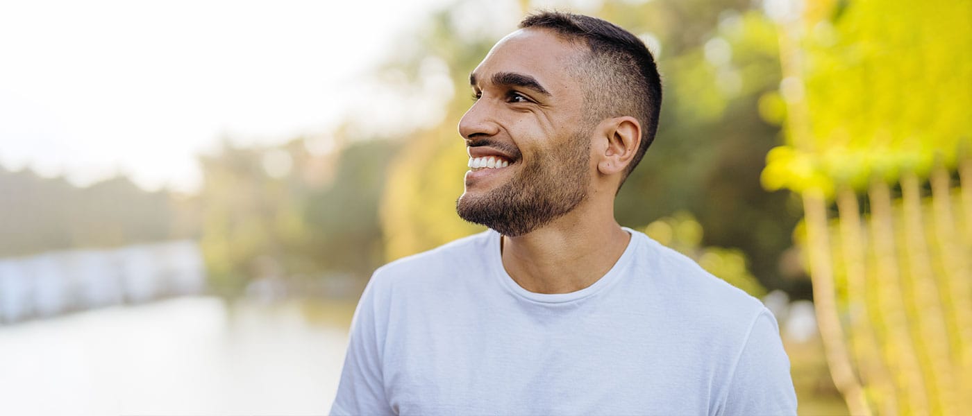 Happy man outside after Mounjaro tretment from Genesis Lifestyle Medicine.