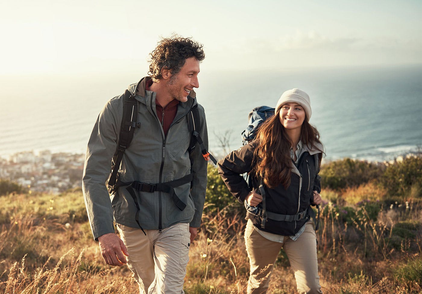 Couple hiking after receiving hormone therapy at Genesis Lifestyle Medicine.