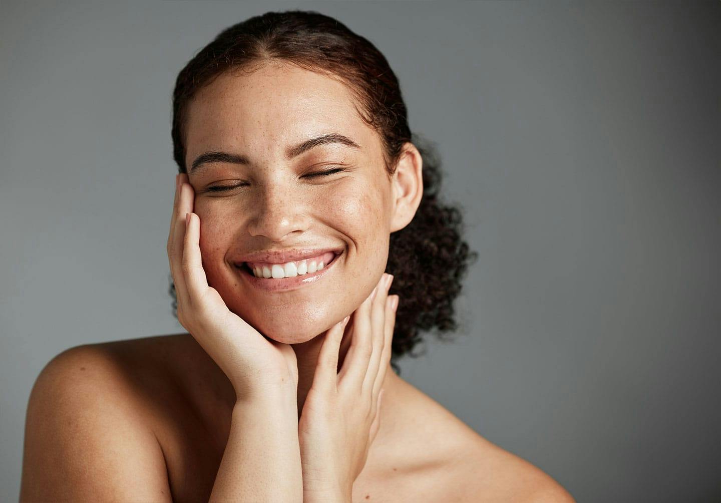 A woman happy with her results from a vampire facial in Los Angeles