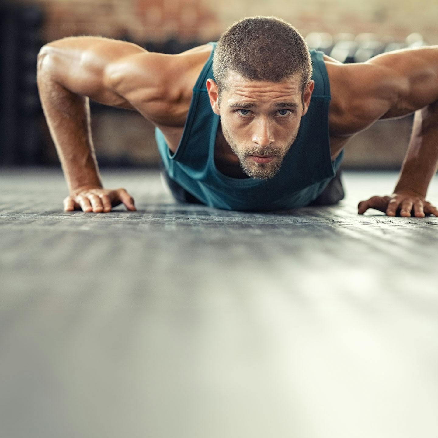 a man doing a push-up after getting GLP-1 in Riverside.