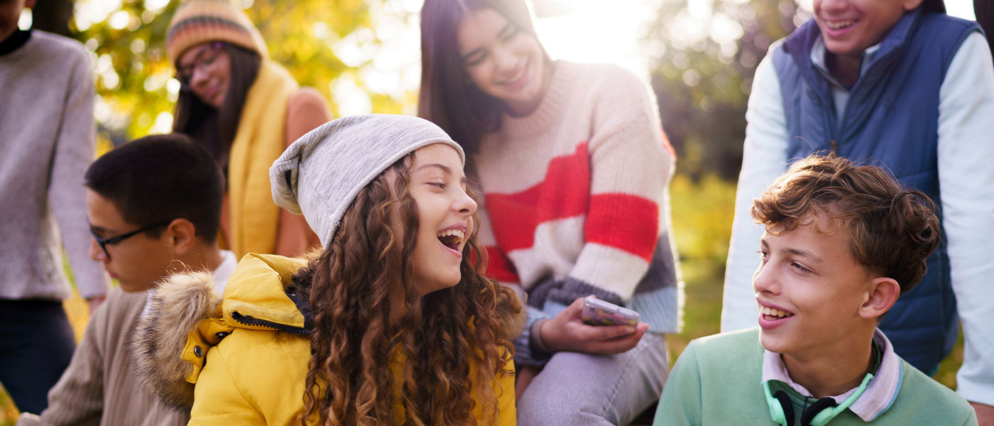 Laughing teenagers after hormone therapy from Genesis Lifestyle Medicine.