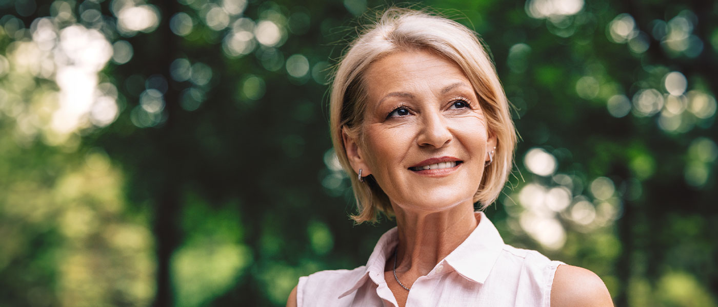 Smiling woman after HRT from Genesis Lifestyle Medicine.