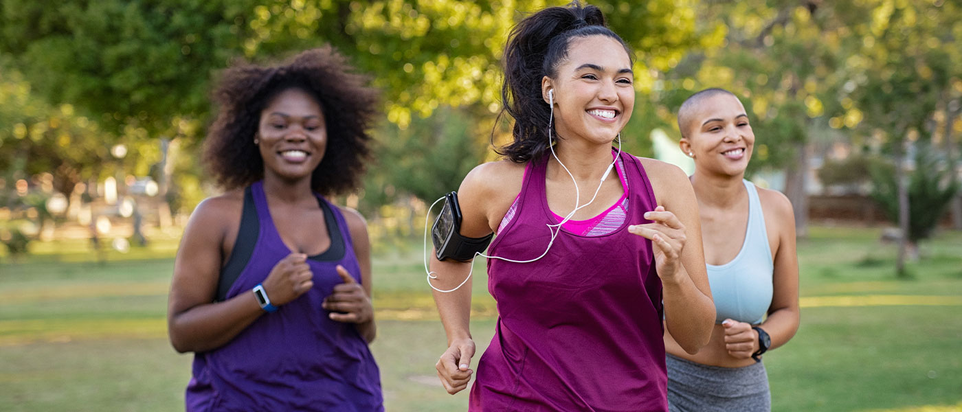 Happy friends jogging after taking GLP-1 medication from Genesis Lifestyle Medicine.