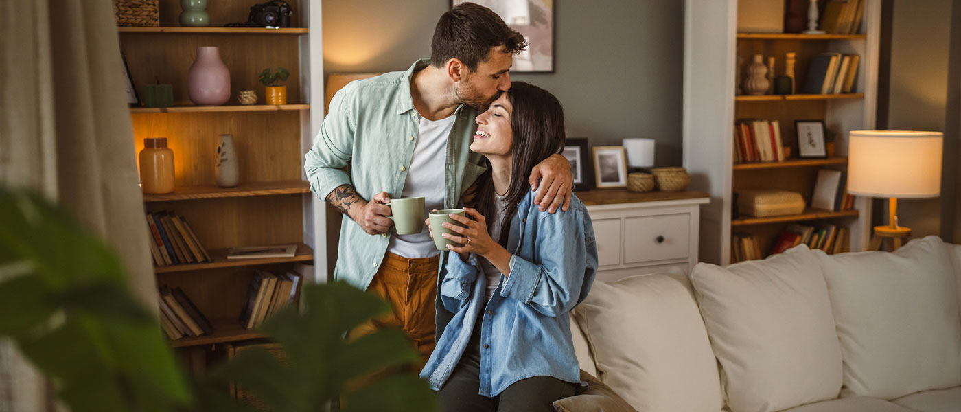 Man kissing his wife after GAINSWave therapy from Genesis Lifestyle Medicine.