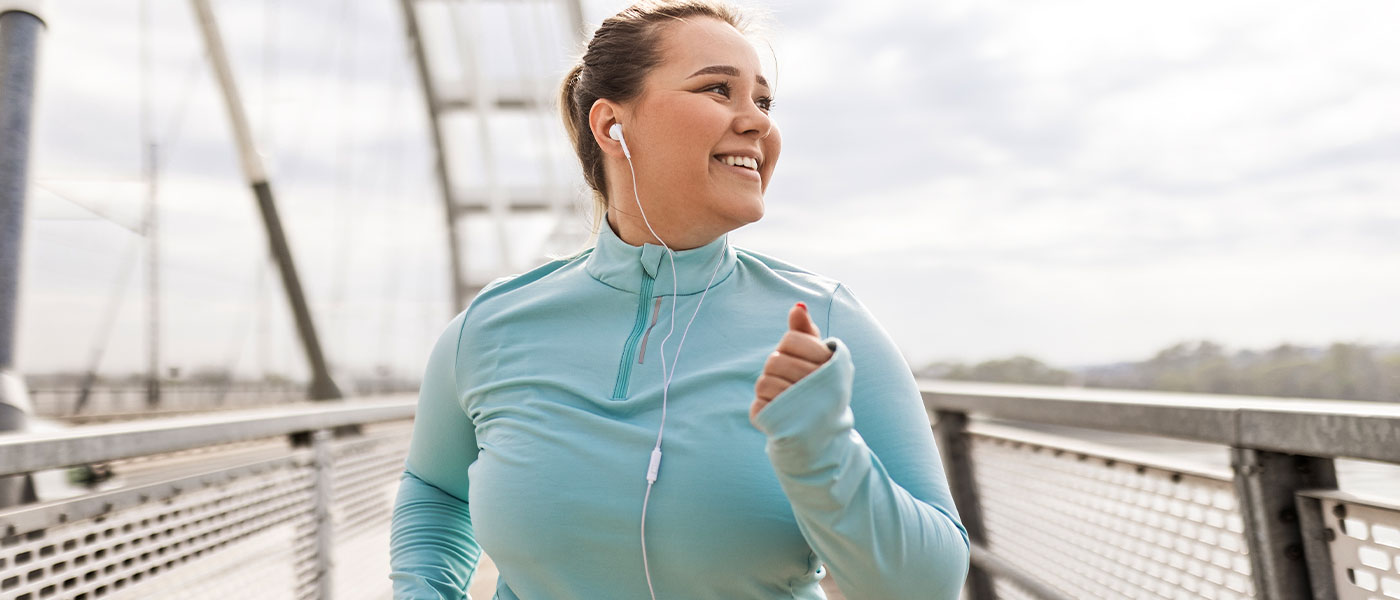 Woman jogging outside after taking GLP-1 medication at Genesis Lifestyle Medicine.