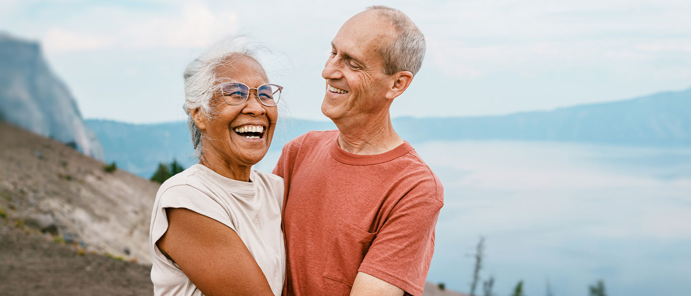 Happy couple embracing after successful medical weight loss treatment at Genesis Lifestyle Medicine.