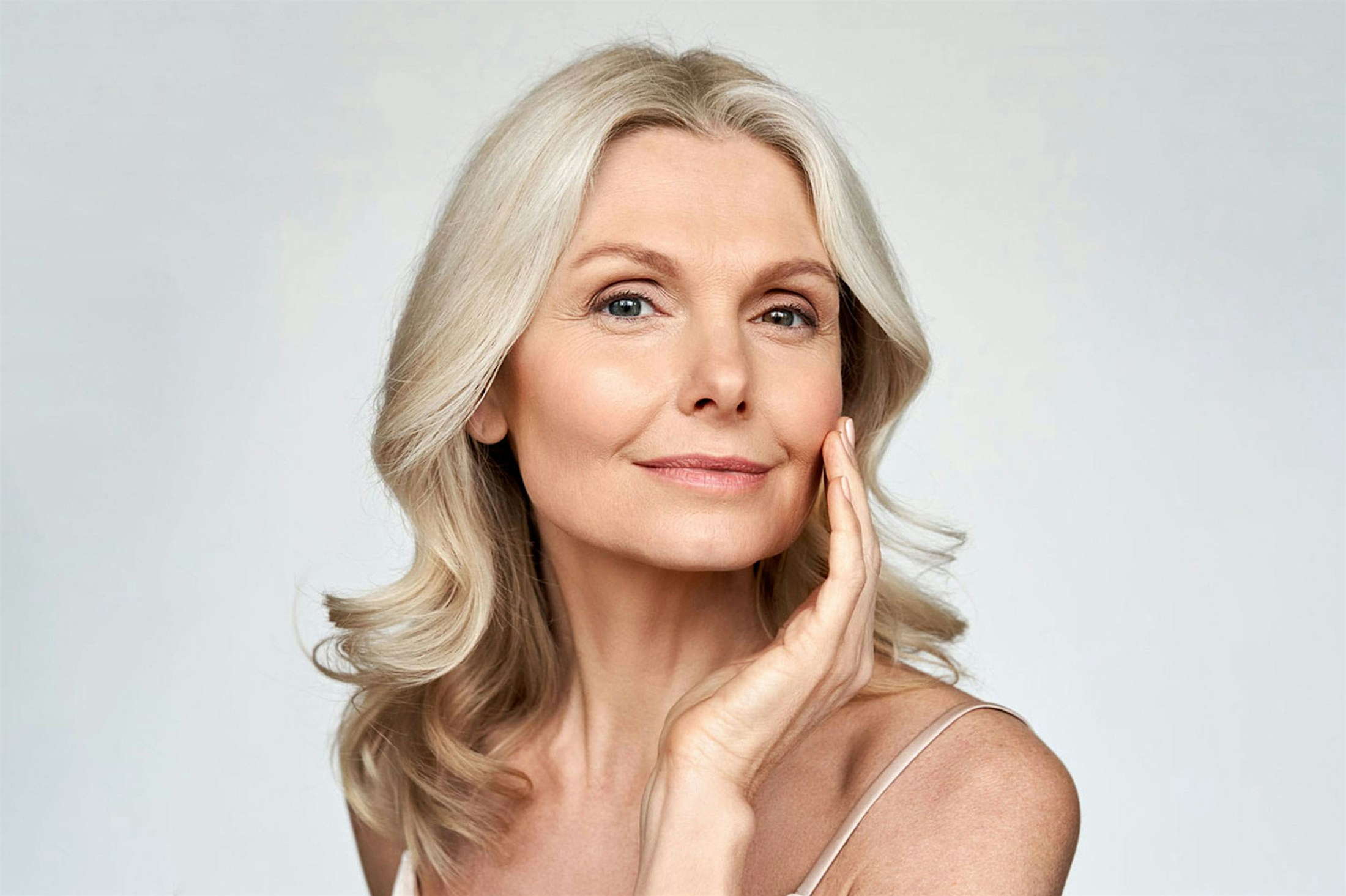 older woman with flawless skin after dermal fillers in Nashville, TN