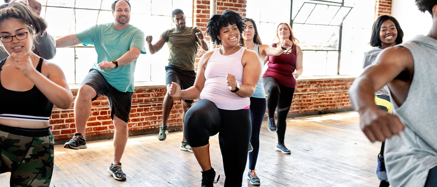 Motivated client participating in group workout class, feeling stronger and more focused with Sermorelin therapy from Genesis Lifestyle Medicine.
