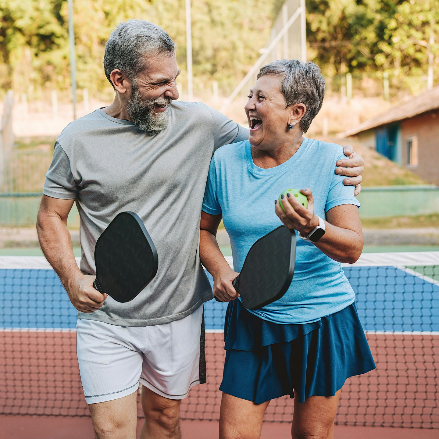 happy couple playing tennis after Methylene Blue treatment in Nashville