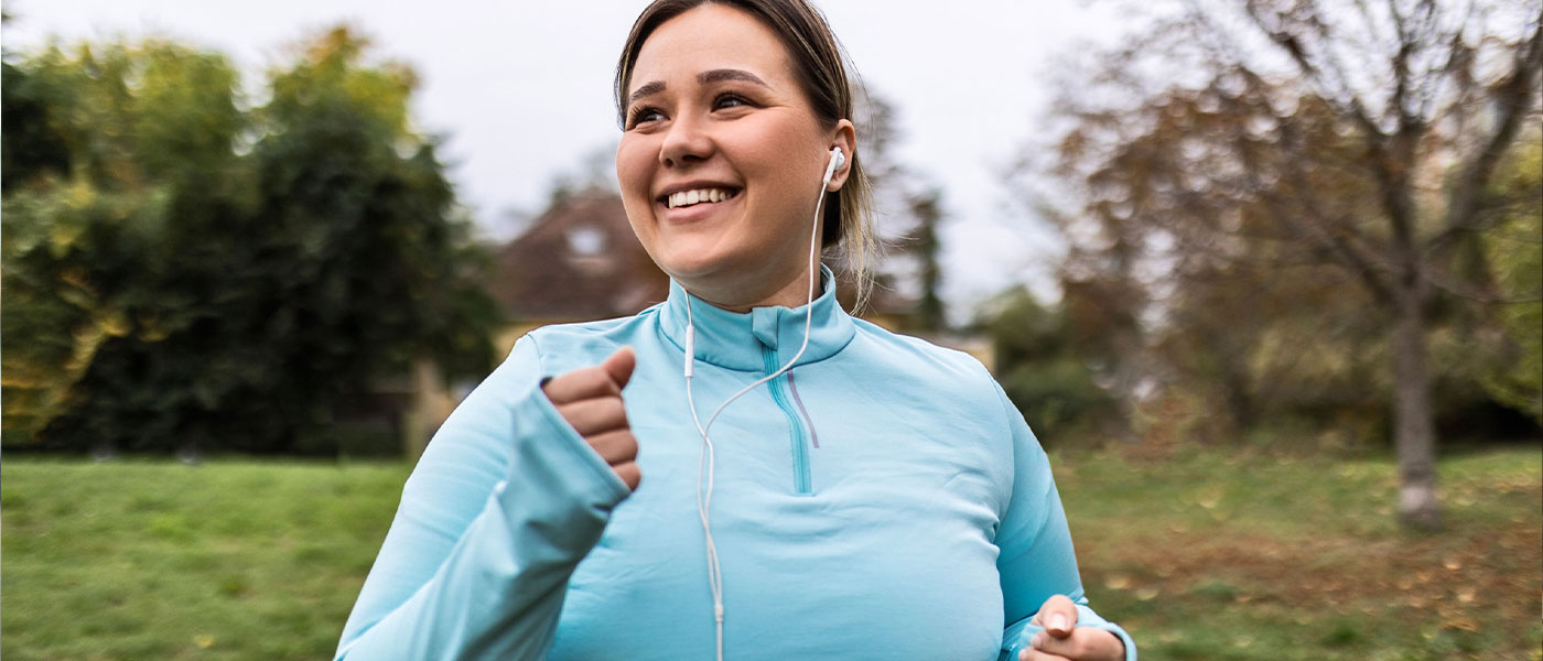 Woman jogging outdoors, symbolizing increased energy and endurance from Sermorelin therapy at Genesis Lifestyle Medicine.