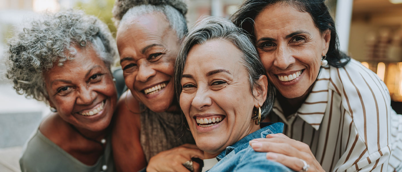 group of older women smiling after starting sermorelin therapy