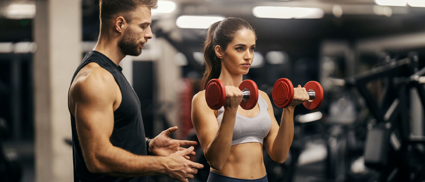 woman working out with a trainer after sermorelin therapy