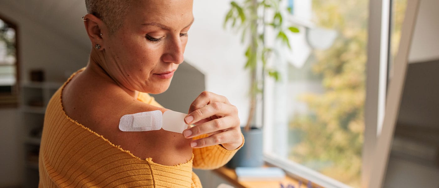 woman applying her NAD+ patch