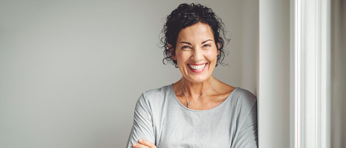 older woman smiling after taking NAD+