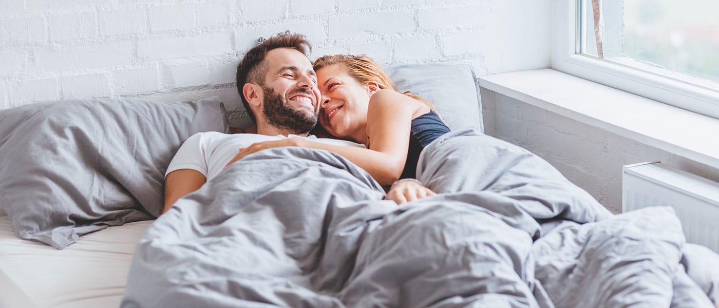 couple in bed together after starting P-Long treatment