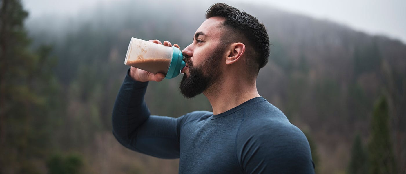 man drinking a healthy shake after starting P-Long treatment