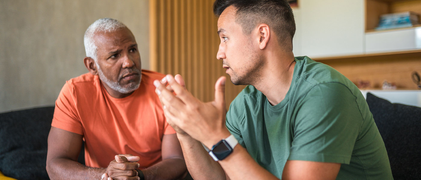 older man and younger man discussing P-Long treatment