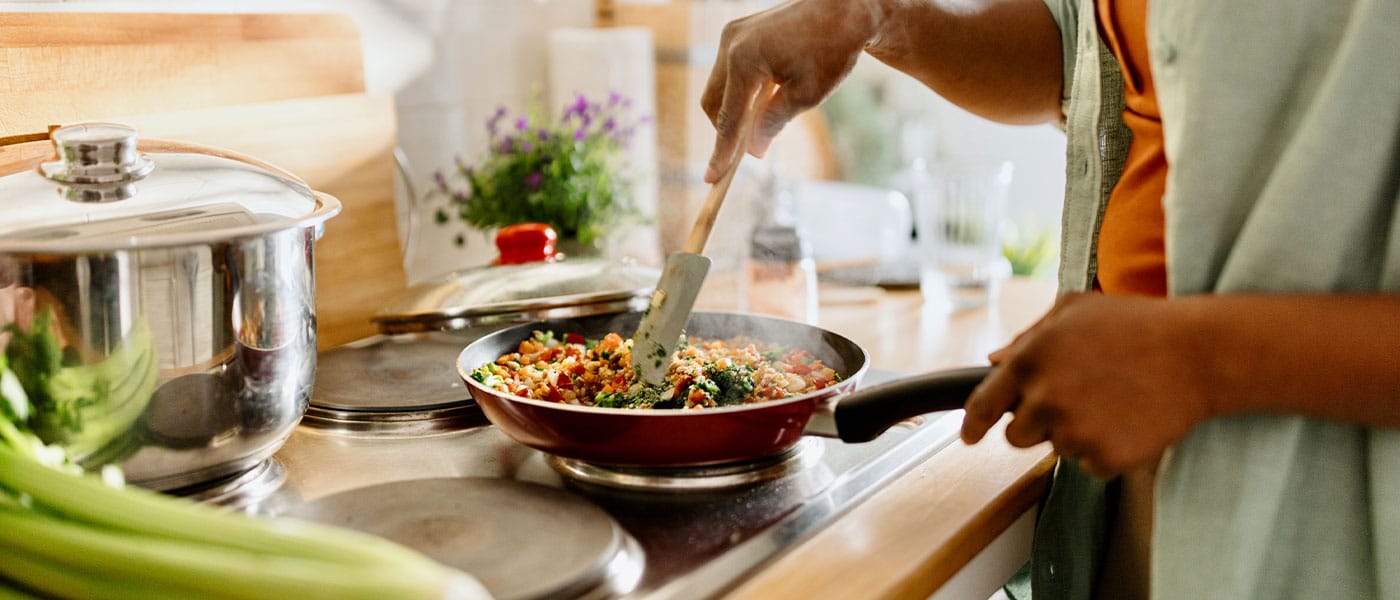 person making a healthy meal after starting NAD+ therapy