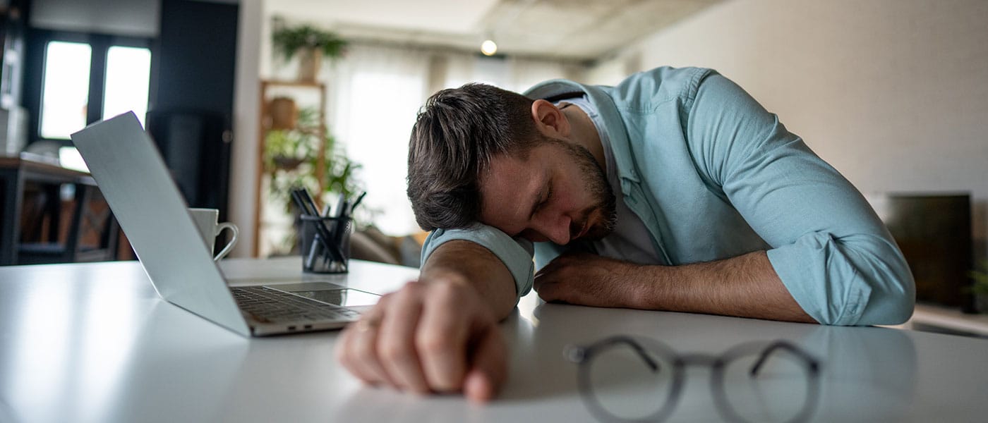 man struggling with low energy before starting NAD+ therapy