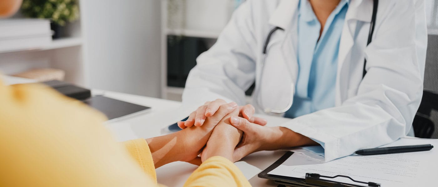 woman speaking with her provider about NAD+ therapy