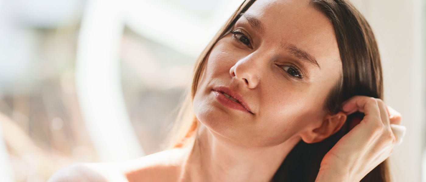 woman with glowing skin after starting sermorelin therapy