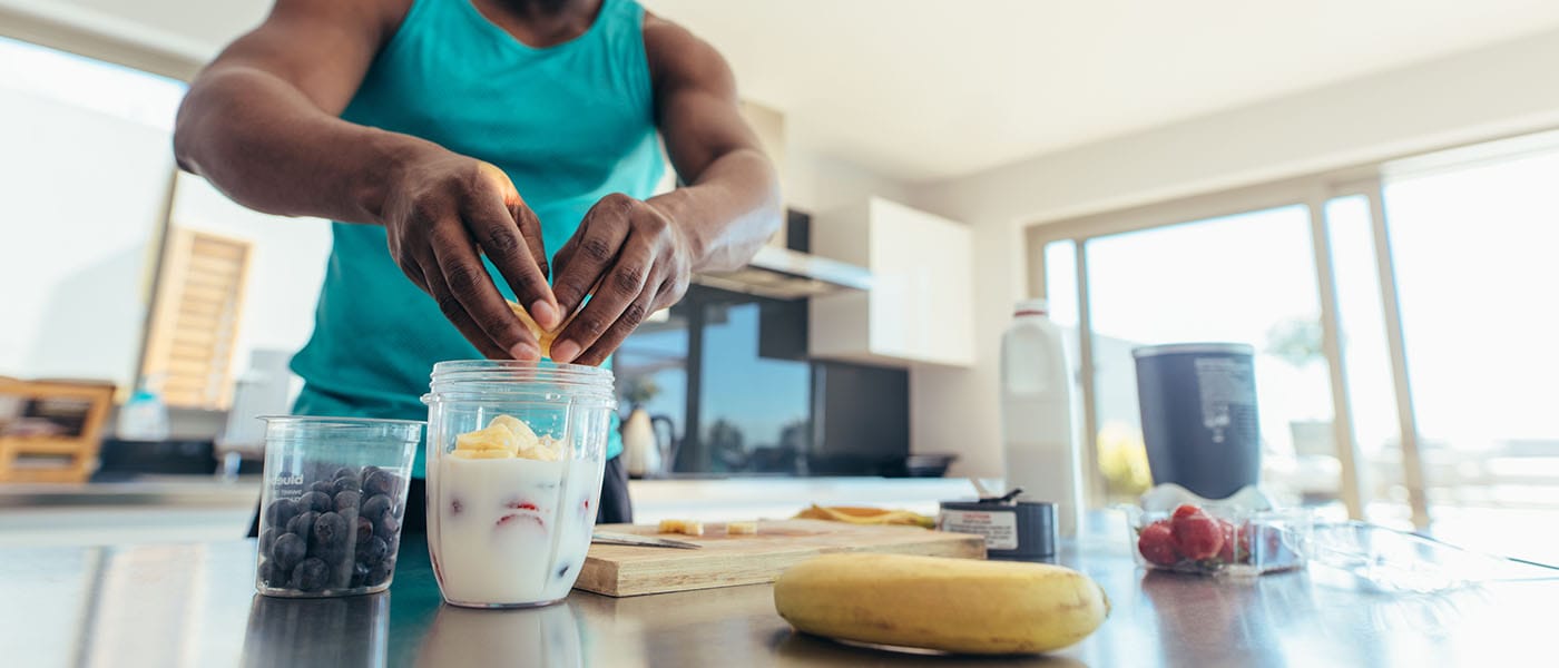 man making a healthy smoothie after starting sermorelin therapy