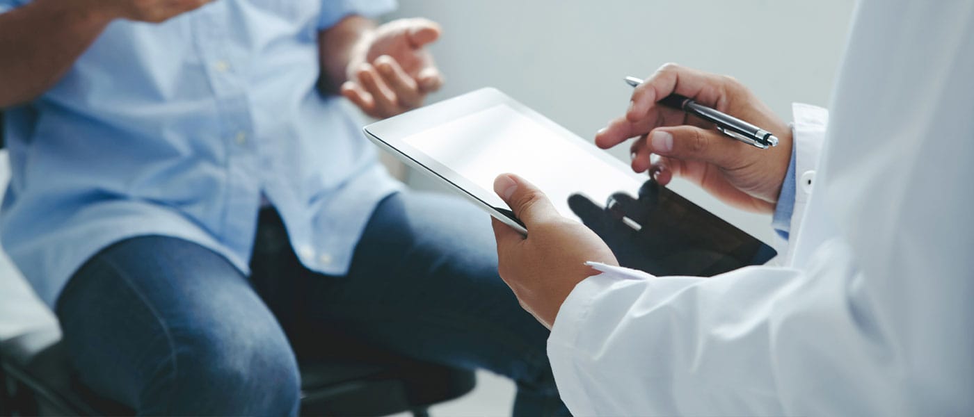 doctor discussing the P-Shot with his patient