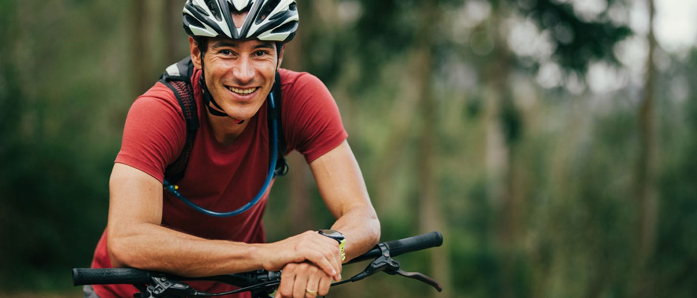 man biking outside after getting the P-Shot