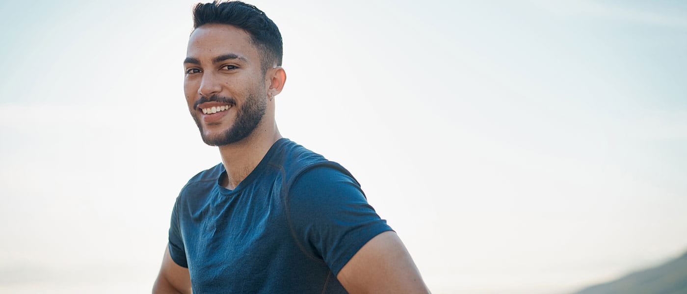 man outside smiling after starting P-Long treatment