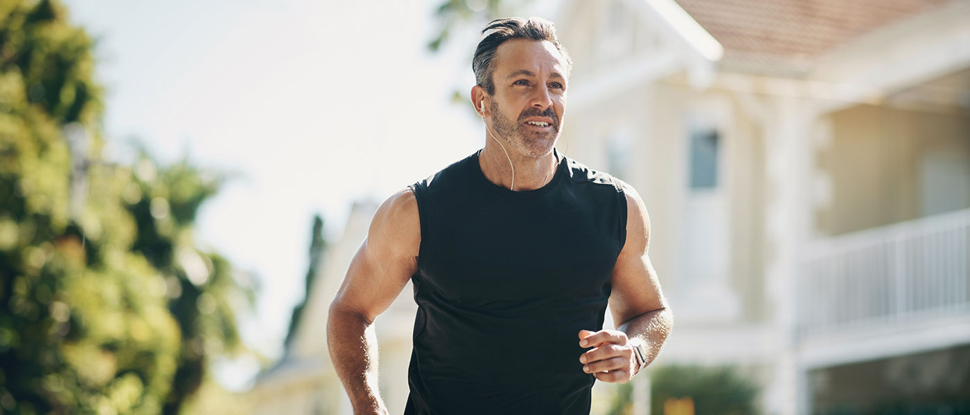 older man running outside after starting P-Long treatment