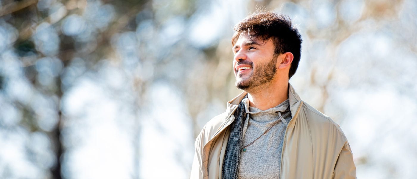 man smiling after starting testosterone therapy