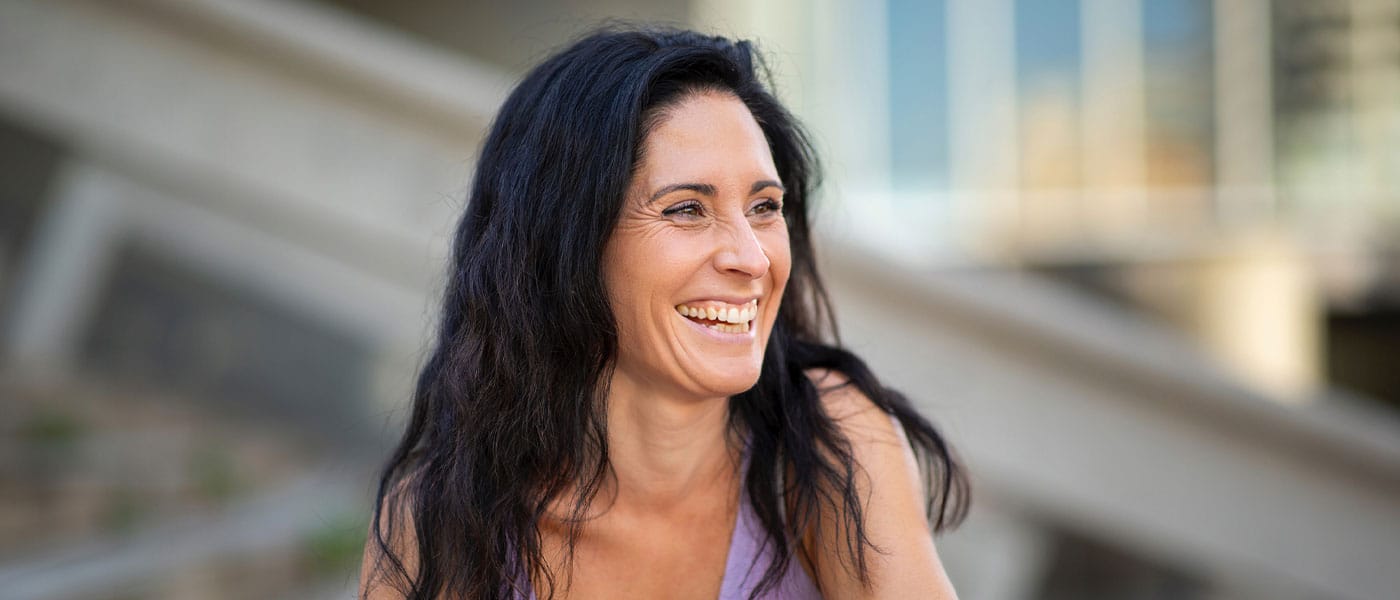 older happy woman after starting hormone therapy