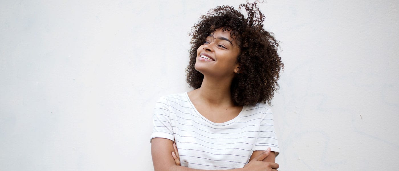 woman smiling after starting hormone therapy