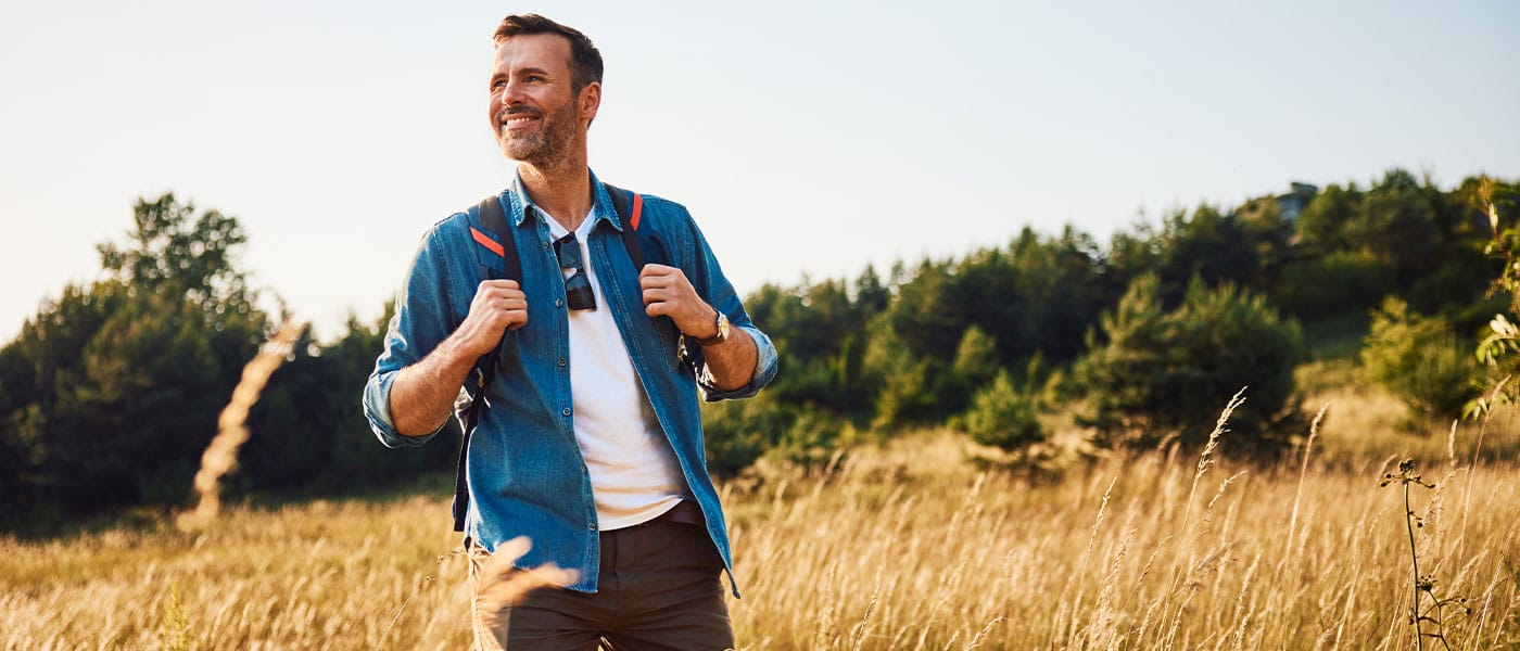 man hiking after starting NAD+ therapy