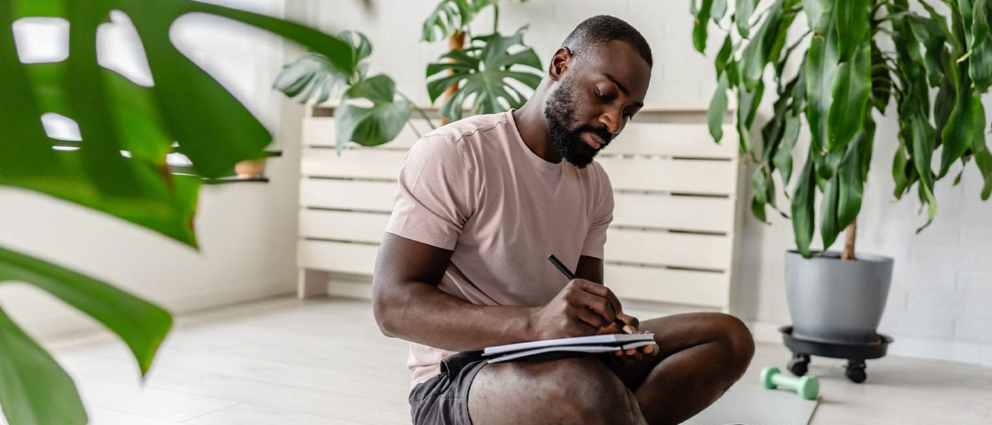 man journaling after starting NAD+ therapy