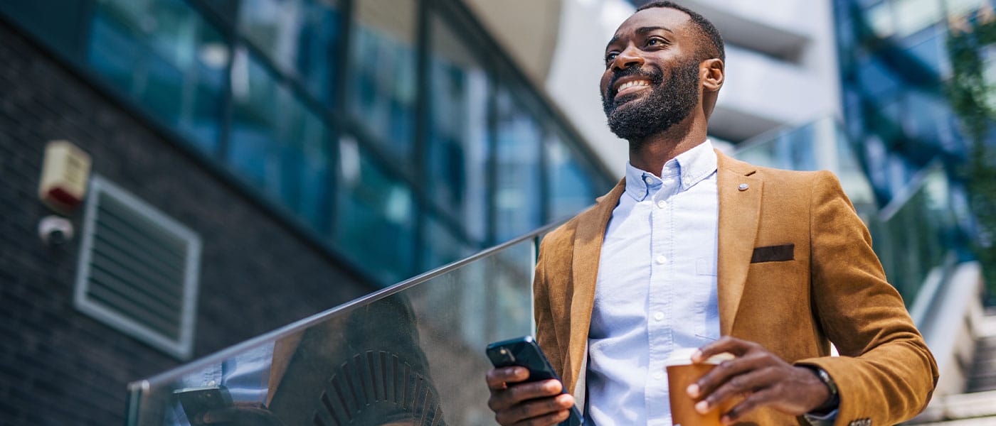 man smiling after starting NAD+ therapy